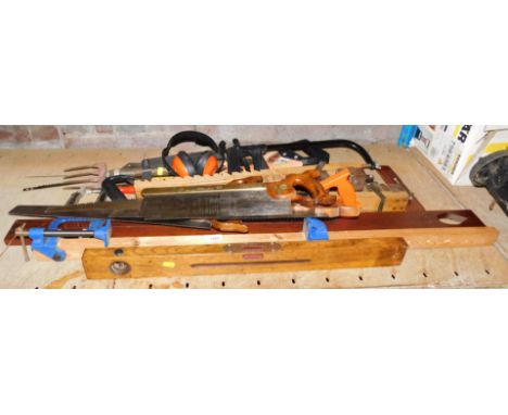 A quantity of carpenter's tools, including a high quality nonpareil tenon saw, an oak spirit level, a series of G clamps, etc