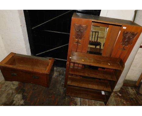 A hardwood cabinet, with Art Nouveau style carvings, with a large mirrored centre opening door, and an oak four shelf freesta