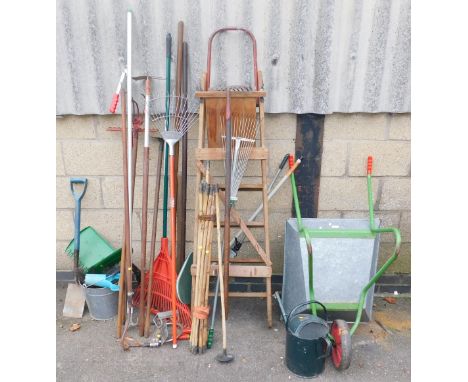 A quantity of garden tools, including a galvanised wheelbarrow, a selection of garden tools, rakes, hose, brushes, galvanised
