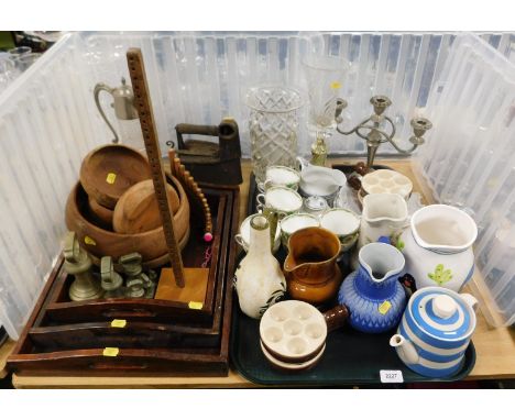 A collection of wooden serving trays, a mixed set of brass imperial weights, a part tea service, together with a Cornish ware