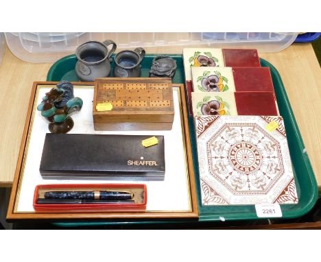 A quantity of Victorian ceramic tiles, 15cm x 15cm, a group of early 18thC pub measures, an Art Nouveau pewter pill box, a Co