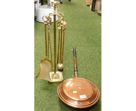 A brass fireside companion set, including pokers, toasting fork, brush, and hand brush pan, mounted on brass frame, together 