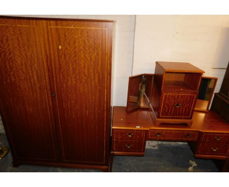 A teak bedroom suite, consisting of a double wardrobe, approx 180cm high, 120cm wide, 56cm deep, a dressing table with pedest