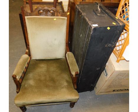 A large black steel trunk, approx 25cm high, 40cm deep 110cm long, together with a hardwood framed nursing chair with galleri