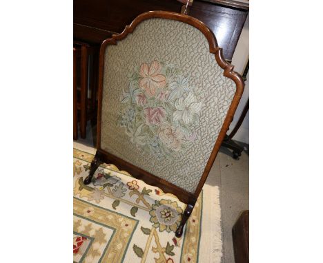 A 1920s walnut framed fire screen with embroidered panel, 20" wide 