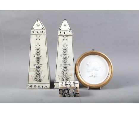 A pair of bone obelisks, 12 1/4" high, a mother-of-pearl box and a Classical plaster relief decorated panel, in gilt frame, 7