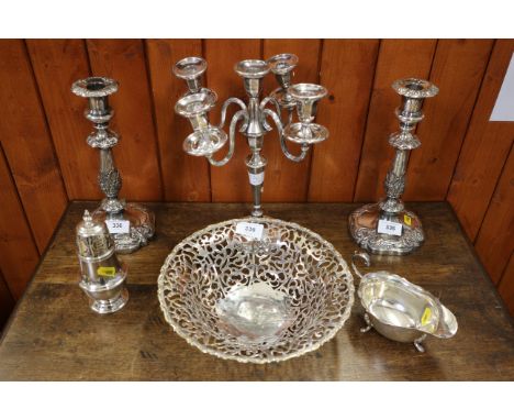 A pair of silver plated candlesticks, 10" high, a plated bowl with pierced decoration, a four-branch five-light candelabrum, 