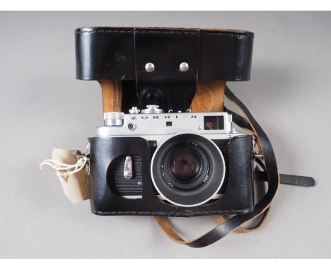 A Zorki-4 rangefinder camera with Jupiter 50mm f2 lens, in ever-ready case,&nbsp;an Exacta VX1000 SLR camera in ever-ready ca