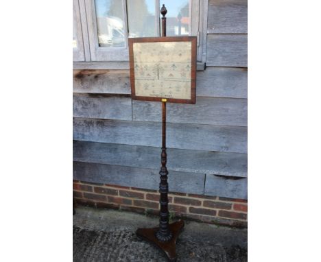 An early 19th century pole screen with rosewood framed sampler panel, worked by Lucy Pridgeon 1809 