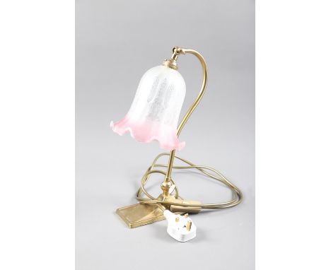 An adjustable brass desk lamp with pink etched shade 