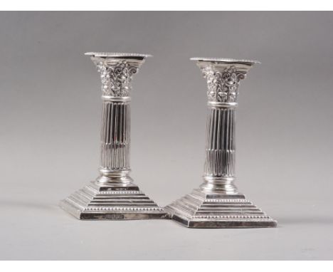 A pair of silver Corinthian column candlesticks, on stepped bases, 6 1/4" highCondition: Sheffield 1905.One sconce has split 