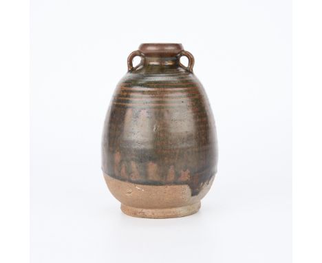 Chinese Ming dynasty ceramic hu vase. With two small handles extending from the upper rim to the high shoulder. With an iron-