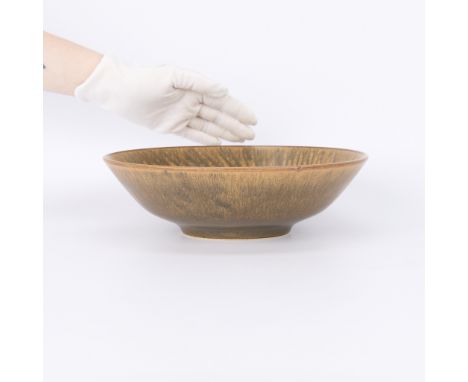 Carl-Harry Stalhane (Swedish, 1920-1990) for Rorstrand, Sweden. Ceramic haresfur drip glazed stoneware bowl with a delicately