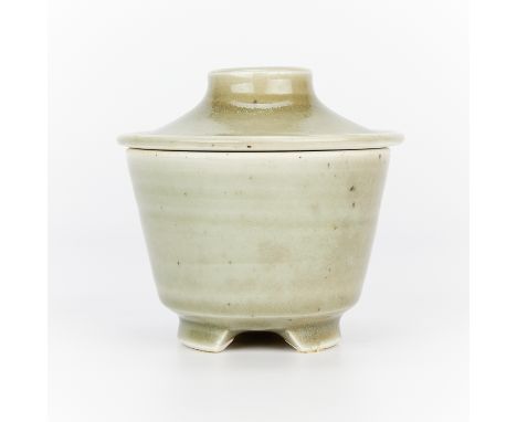 Warren MacKenzie (American, 1924-2018). Small studio porcelain covered vessel or bowl. With a grey-green glaze and tripod fee