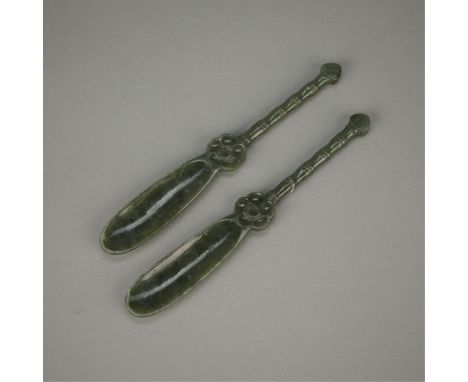 Pair of Chinese carved jade netsuke spoons or tea scoops. Each spoon is of a rich and verdant spinach green jade with a flowe