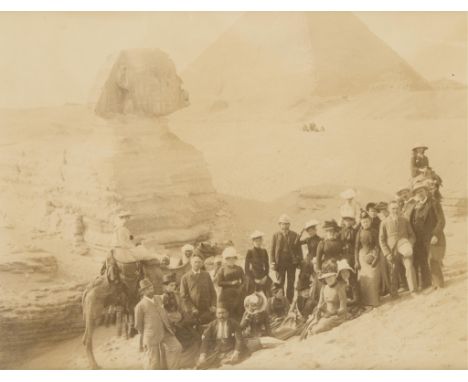 Late 19th century albumen photograph print depicting a large group of figures posing in front of the Great Sphinx and the Gre