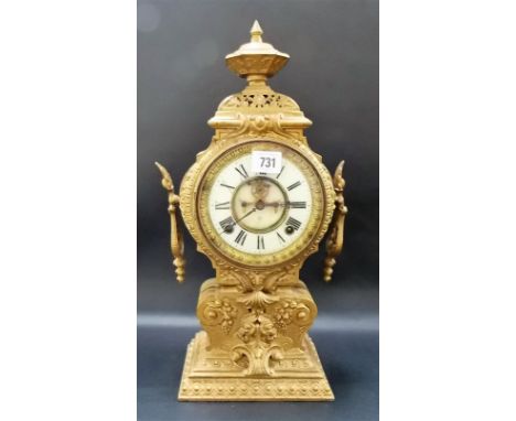 Spelter two-train mantel clock, the 4.5in enamel dial with recess visible escapement, height 17in