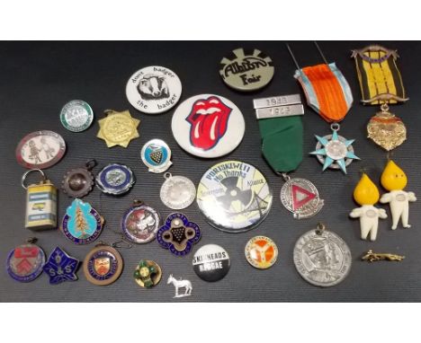 Collection of vintage metal badges, some in enamel.