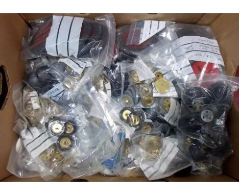 Box containing a quantity of vintage Meccano tyres and pulleys 