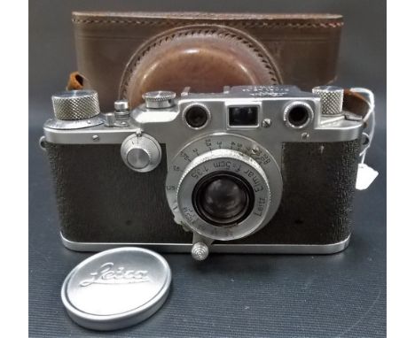 Leica D.R.P. Ernst Leitz Wetzlar camera, no. 495134, with Leitz Elmar f=5cm 1:3, 5 lens (af) within original leather case.