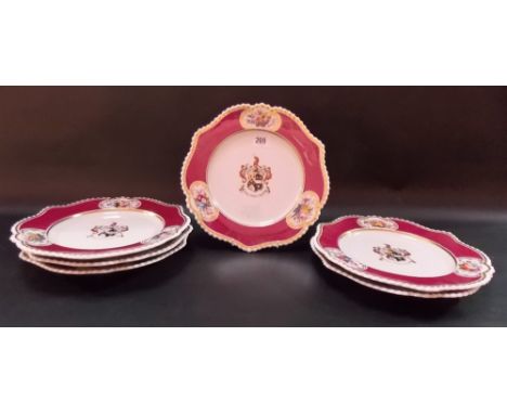 Set of six Chamberlain Worcester armorial plates, the border with three panels of flowers upon a burgundy ground, impressed m