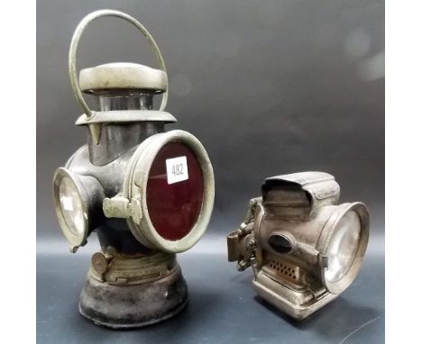 A Lucas 'NEW' Holophote' bicycle lamp; together with a tin plate rear carriage lamp (2).