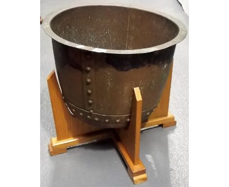 Copper riveted circular planter, diameter 18in, upon a later oak stand.