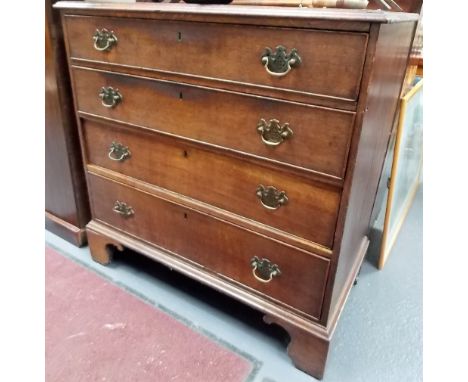 George III oak chest of four long graduated cock beaded drawers raised on bracket feet, width 38in.