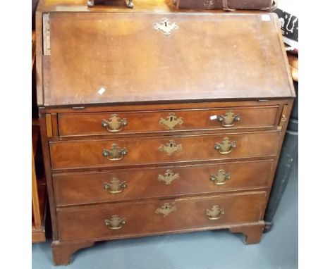 George III mahogany veneered and crossbanded bureau, the fall front with pigeonholes and an arrangement of six drawers and a 