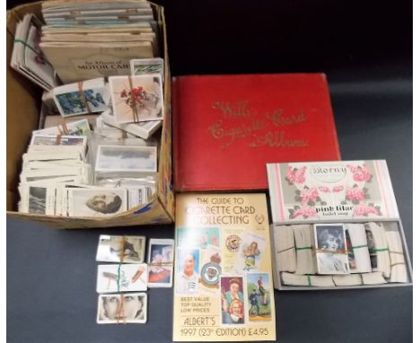 Large quantity of vintage cigarette cards and two empty albums 