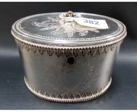 George III Old Sheffield plate oval tea caddy with front engraved ribbon shield cartouche, embossed stiff leaf and beaded ban