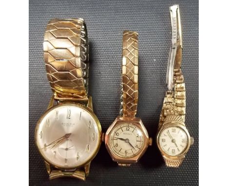 Two 9ct gold cased manual wind ladies' wristwatches; together with a gentleman's manual wind gold plated wristwatch, the dial