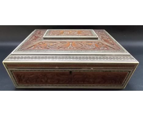 Good 19th Century Anglo-Indian sandlewood ivory inlaid sadeli box, of caddy form carved with animals and birds, the lid hinge