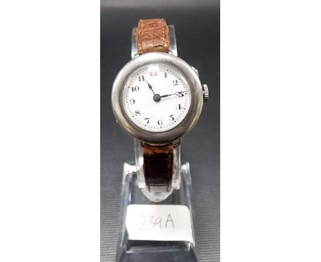 Silver lug wristwatch, the white enamel dial with Arabic numerals.