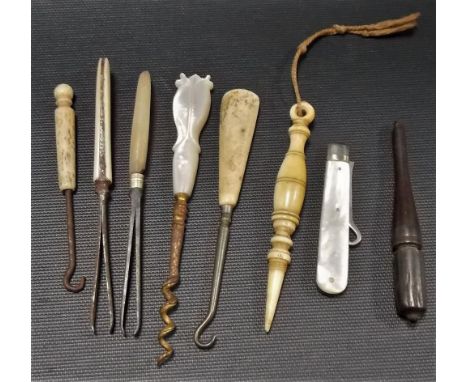 Collection of sewing implements including a silver folding button hook with mother of pearl handle.