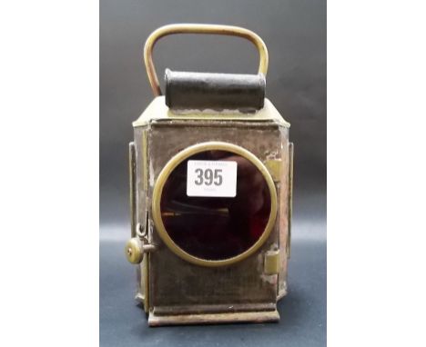 Vintage automobile brass and tin plate rear light with glass circular lens and bubbled glass panels, height 8.75in.