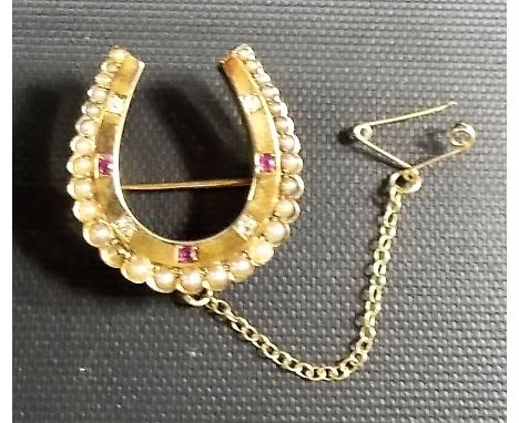 Victorian yellow metal diamond, ruby and seed pearl set horseshoe shaped brooch, weight 7.3g approx.