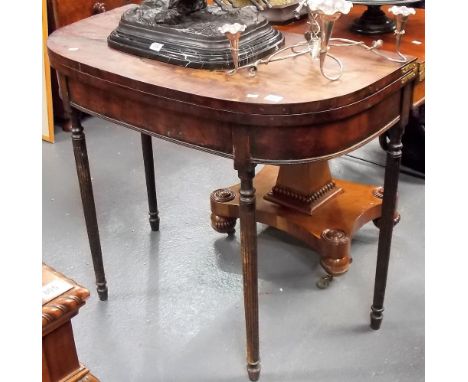 George III mahogany demi-lune card table, the hinged top revealing a green baize inset and on four turned and fluted legs, wi