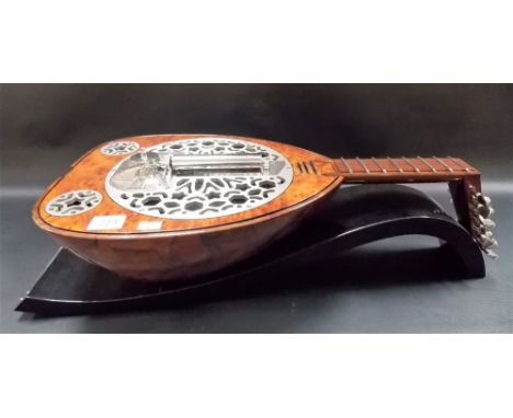 Contemporary REUGE musical box playing 3 airs in the form of a lute, width 26in, the tunes payed are 'Another Brick in the Wa