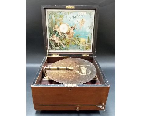 Early 20th Century walnut cased polyphone playing 8.5in discs with 64 additional discs (all teeth present)
