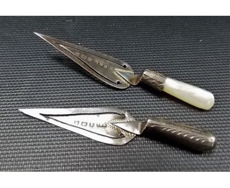 Edwardian silver trowel bookmark with mother of pearl handle, the maker W.H.L; together with another silver trowel bookmark (