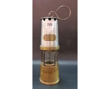 A brass and steel miners lamp by Naylor Wigan.