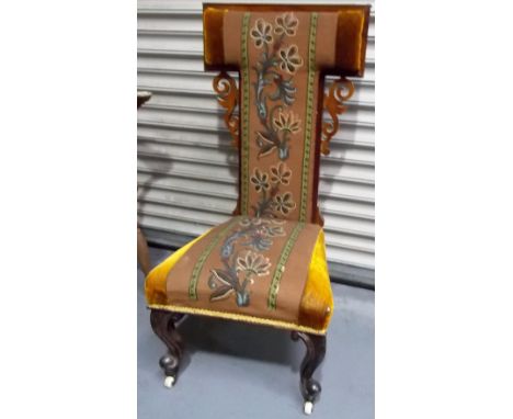 19th Century rosewood upholstered prie dieu chair upon cabriole forelegs with ceramic castors.