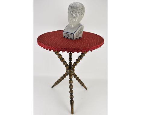 A late Victorian bobbin turned gypsy table, on tripod legs and associated top upholstered with a woven red fabric with fringe