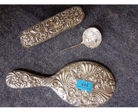 A white metal hand mirror and clothes brush, together with a white metal ladle, Location: BWR 