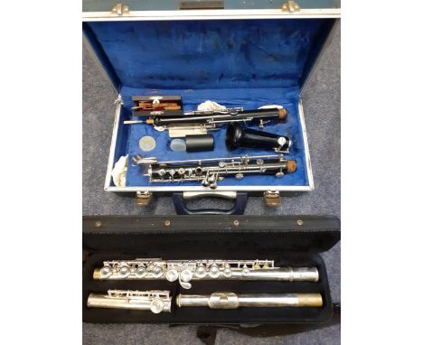 A Virtuosi silver coloured flute in travel case together with a B &amp; H. Bandhite clarinet A/F (missing mouthpiece) with tr