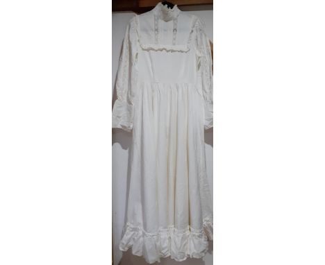 Vintage Laura Ashley ivory cotton full length and long sleeved dress with high collar, full skirt and frilled bodice and tier