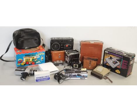 A mixed lot of electrical items to include Polaroid cameras, binoculars and Pacemaker 300 Super 8, together with a Nintendo W