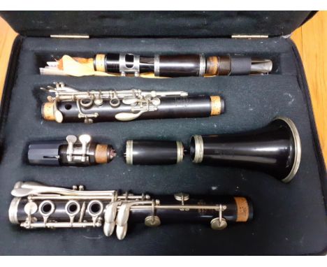 A Buffet clarinet with additional mouth-pieces, in a travel case 