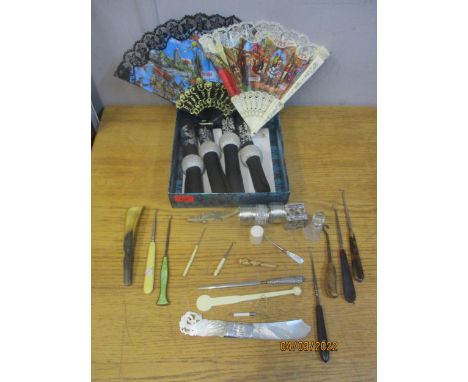 A mixed lot to include a mother of pearl and white metal letter opener, button hooks and other items to include Middle Easter